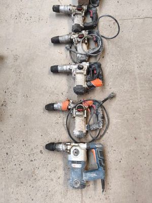 many different types of power tools lined up on the floor