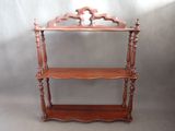a wooden shelf with a mirror on top of it