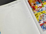 an open book with a comic strip in it