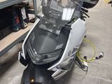 a scooter that is parked in a garage