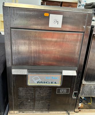 an image of a stainless steel ice machine sitting on a pallet