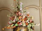 a vase of flowers sitting on top of a table