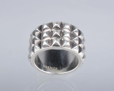 a close up of a silver ring on a white surface