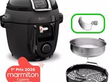 un gros plan d'une friteuse à air chaud à côté d'une poêle et d'une poêle