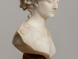 marble bust of a woman on a wooden base