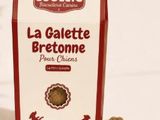packaging design for dog biscuits with dog silhouettes on the side of it