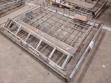 a lot of metal beds that are on the floor