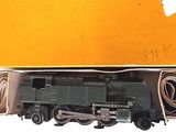 a toy train that is in a box on the table