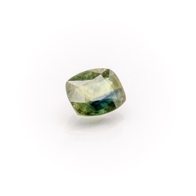 a green tourmaline gemstone on a white background