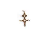an image of a gold cross pendant on a white background