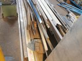 several pieces of wood are stacked on top of each other in a warehouse