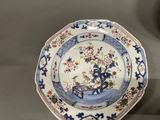an image of a blue and white plate with flowers on it