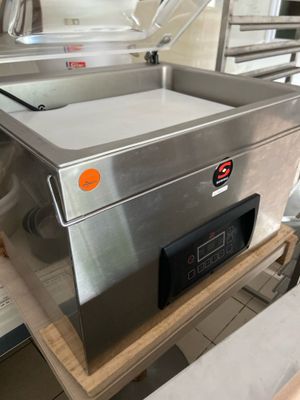 a machine that is sitting on a table in a kitchen