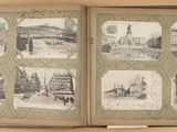an open book with pictures of a city in it