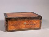 a small wooden box with a lock on it