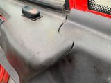 a close up of a car door handle with a hole in it