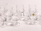 a lot of empty wine glasses sitting on a table