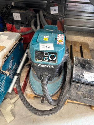 a machine that is sitting on a pallet in a garage