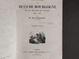an open book with a picture of a horse drawn carriage on it