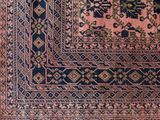 an antique persian rug with a blue and pink design