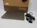 a box with a laptop and a charger on it