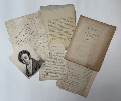 several old letters and papers with a picture of a man in a suit