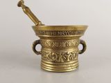 an antique brass mortar with a pestula in it on a white surface