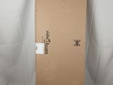 a cardboard box sitting on top of a white sheet