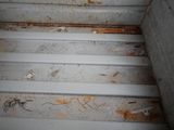 a close up view of a dirty metal structure
