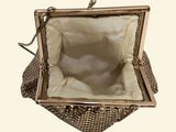 an image of a purse that is sitting on top of a table