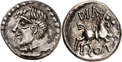 a silver coin with an image of a man on a horse
