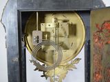 a clock that is sitting in the middle of a room