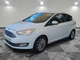 a white ford c - max parked on a checkered floor