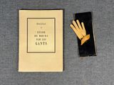 an image of a book with a pair of gloves next to it
