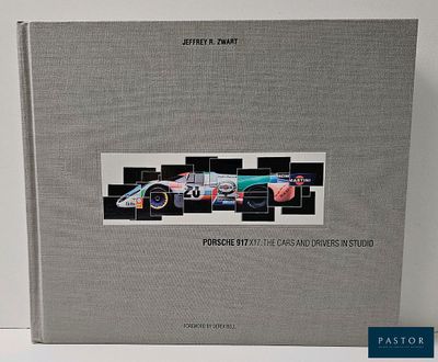 a book with a picture of a racing car on it