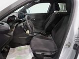 the interior of a car with the door open and the passenger seat down