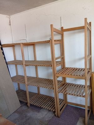 a room with a bunch of wooden shelves in it