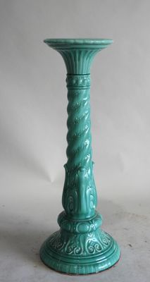 turquoise green candle holder on a white background with a white background