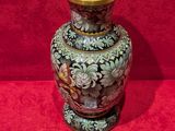 a vase that is sitting on a red surface