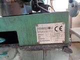 a picture of a machine that is working on a piece of metal