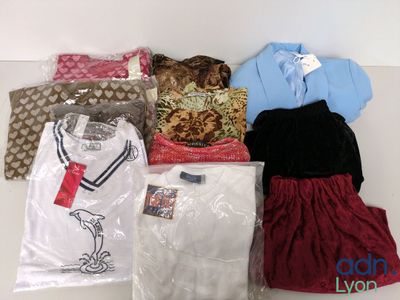 a lot of clothes that are sitting on a table