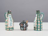 three vases sitting next to each other on a table