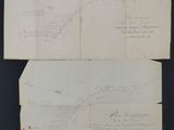 two pages of paper with drawings on them on a black surface