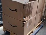 two boxes stacked on top of a pallet in a warehouse