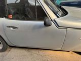 a small car parked on the side of the street