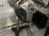 a glass display case with a fan on it in a kitchen