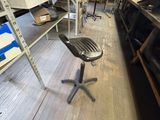 a chair that is sitting in the middle of a room