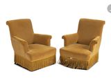 pair of chairs with fringed legs and a foot stool