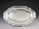 a silver plate that is sitting on a table