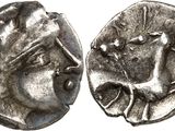 a silver coin with an image of a man on it